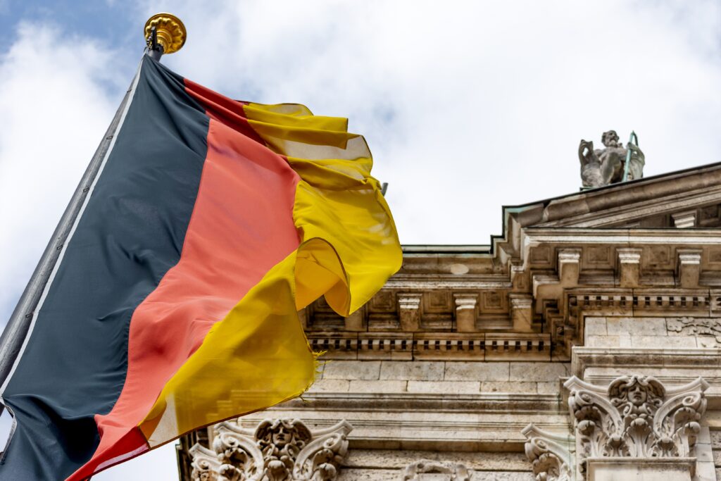 german-flag-waving-in-front-of-the-building-in-mun-2021-08-30-11-10-09-utc